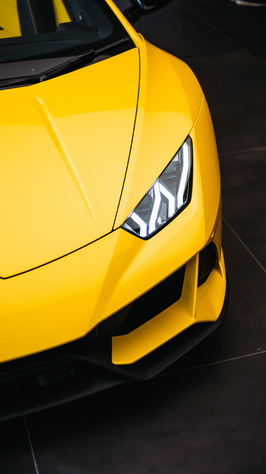 Yellow Sports Car in Close Up Photography
